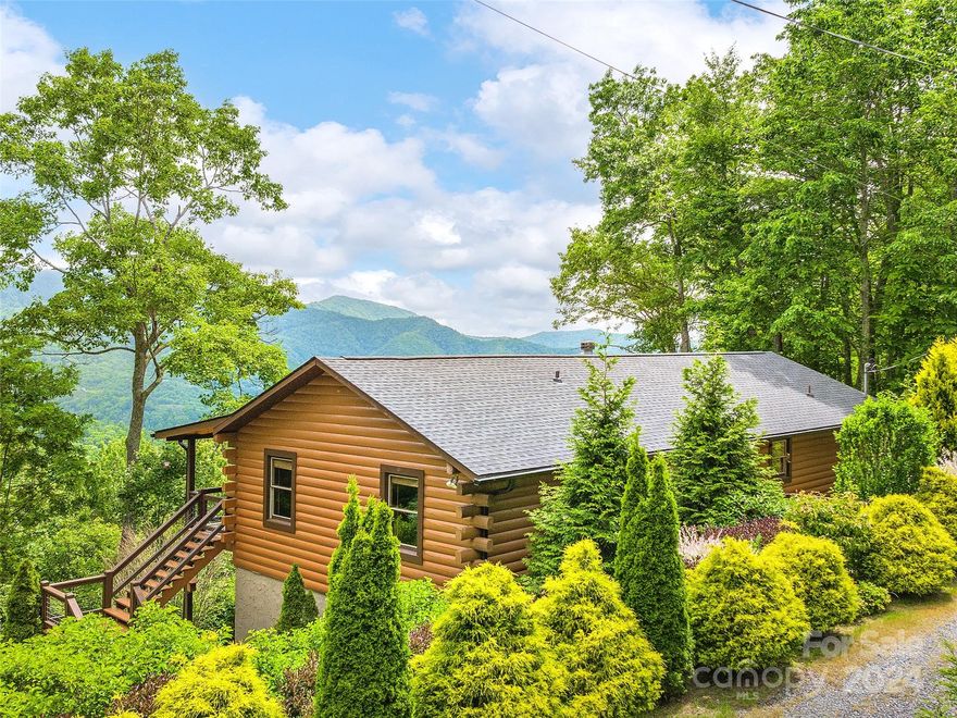 Tucked into the heart of the Blue Ridge Mountains of Western North Carolina, this well maintained and
thoughtfully updated cabin on nearly 3 acres is a haven of tranquility and natural beauty. The
primary suite and one bedroom with an additional flex/office space with closet is conveniently located on the main level offering cozy sanctuaries in which to retire after a day of mountain adventures. The open kitchen, living and
dining area feature a large picture window boasting an ocean of layered Blue Ridge Mountain views.
The 55'11"x 8' covered outdoor deck is the heart of the home as you gather here to enjoy the ever changing
mountain tapestries of the day and passing seasons. The terrace level of the home offers a versatile
finished room, a dedicated laundry area, another full bathroom, a large unfinished storage space and
attached garage with work shop. 20 min to Waynesville. 15 min to Harrah's Casino. 5 min to Maggie Valley. 10 min to newly reimagined Cataloochee Ranch.