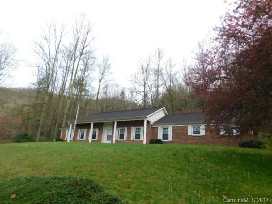 Elegant Brick Ranch home situated on nicely landscaped lot.  Only minutes from downtown Brevard, yet feels like  your living in the country. All living area on one level.  Huge unfinished basement and over-sized double garage. Private screened porch, level back yard, and small creek. Enjoy the expansive country kitchen and large family room, perfect for family get together's. Tons of storage.  Adjoining 3.4 acre tract available for added privacy.  Don't miss this picture perfect home!