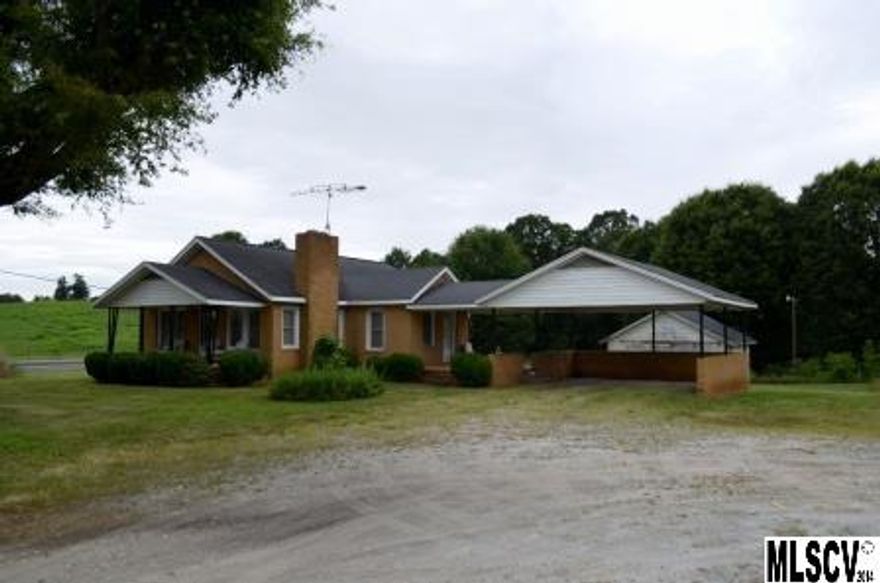 Older brick home just outside city limits within minutes from shopping, restaurants, etc. Features a nice epoxy stone front porch, and outdoor building for storage. Additional acreage is available.