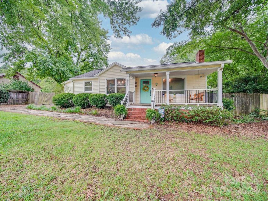 Welcome to this charming ranch style home in an excellent location of Charlotte. Enjoy a large fenced yard and cozy rocking chair front porch. Inside, you'll find original hardwood floors, a beautiful kitchen with open shelving, unique features throughout like pocket doors and glass door knobs which add character. The detached garage offers a versatile entertainment area. Don't miss this blend of modern updates and historic charm!