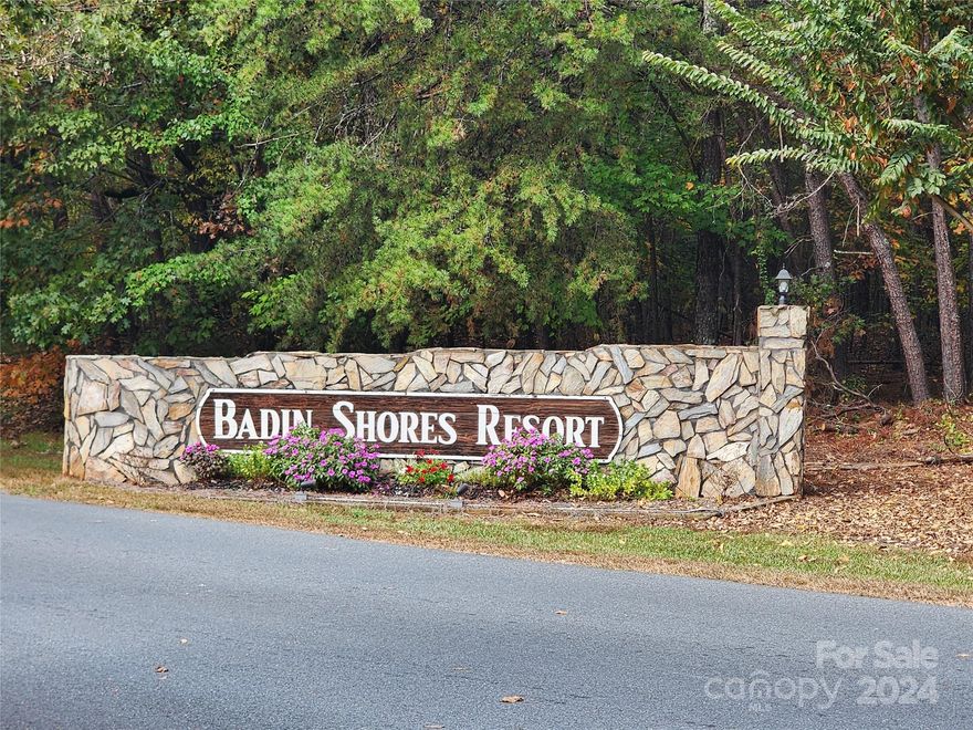 Welcome to Badin Shores Resort, a gated community perfect for relaxation and fun! Enjoy amazing amenities such as a pool to cool off on hot days, basketball courts, a marina and fishing pier ideal for boating and fishing, a beach area for relaxing by the water, putt putt golf and so much more!  This home is perfect for a long-term residence, investment opportunity, or a lake community get away!  Enjoy lake views from the comfort of your screened in back porch!  Recent roof and Heat pump installed in 2020.  10 x 20 outbuilding included for storage.  Schedule your private showing today!
Don’t miss out on owning a piece of this enjoyable resort!
For more Badin Shores Resort info, check out:  https://badinshores.org/
