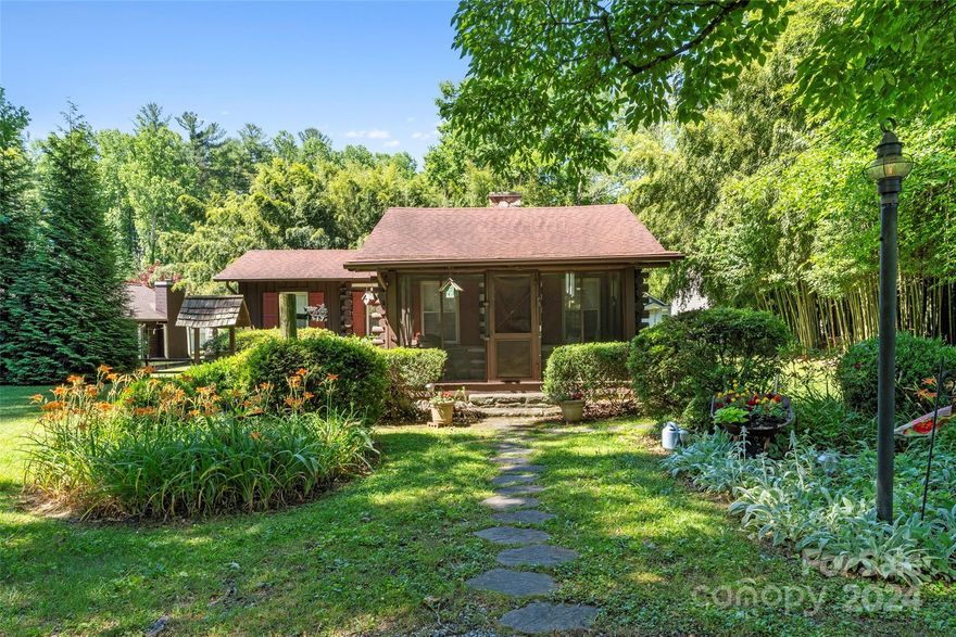 Here is your chance to have the quintessential log cabin in WNC, and yet still be close to everything!! Large almost half acre lot provides privacy with a location convenient to the amenities of Hendersonville and Historic Flat Rock Village. Well cared for with lots of charm! In addition to the inside living space, there is a wonderful screened in front porch as well as a nice sized back deck. This property is located in the Greenville Highway Mixed Use corridor, which allows for all sorts of possibilities. City sewer and water, almost new HVAC and refrigerator. Almost all of the furnishings can be included with this adorable home!