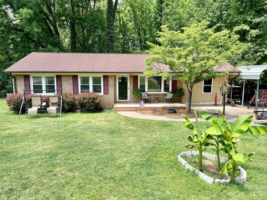 Adorable 3 bedroom brick ranch with rocking chair front porch and nice deck for entertaining that sits on .26 acre lot. Hardwood floors throughout family room and bedrooms. Updated bathroom. New Air Conditioning. Perfect house for first-time home buyers or family downsizing. Great location conveniently located close to shopping, interstates and healthcare Carport has been enclosed for extra storage space/workshop. It can be finished for additional living area.