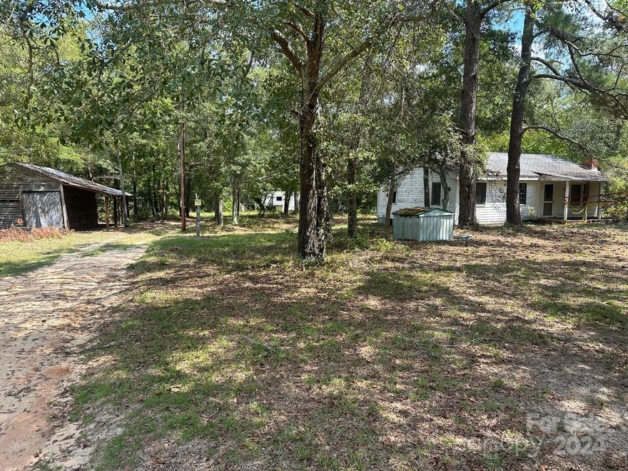 3 acres for sale in the country!  Old abandoned home on property, not livable.  A camper is also on the property that can be conveyed with land but needs work.  Seller will remove, if desired.  A metal shed is also on property. There is water & electricity hooked up already since family uses camper from time to time.   With time, effort, & love, this property could be made beautiful.  Call me or your agent today to see this property.  Might be what you're looking for.