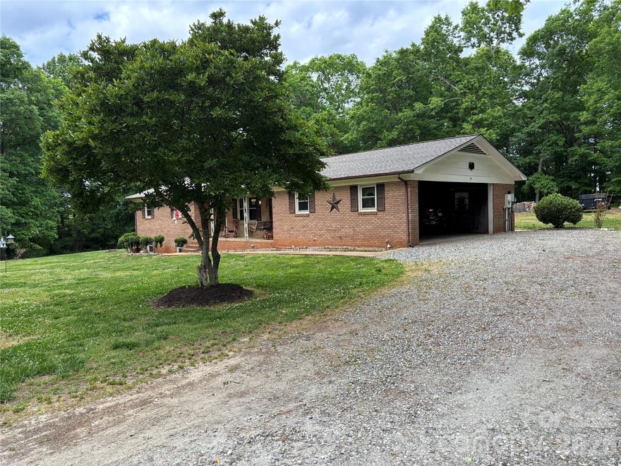 Check out this stunning ranch house with a full basement and 4.631 acres of level part wooded property at the end of this quiet private street. Own this piece of Heaven in the foothills of Alexander County.  Bring all your cars, hobbies, and animals because there is plenty of space for all your needs.  This beautiful property has an additional lot with an older well, septic tank, & power, a RV Metal Shed with 50 amp connect, a storage building with power, and an additional metal shed.  The house has many updates which include a new roof in 2025, a new HVAC heat pump system in 2023, and updated bathrooms.  The house has a brick fireplace in the basement area with a wood stove for additional heat, a concrete pad on the rear & a concrete front porch for all your outdoor entertaining. Not another one on the market and this property will not last long.