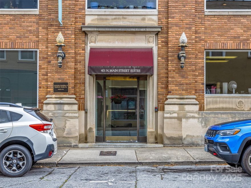 The Community Foundation of Henderson County is offering our Class A office space in a prime location in Historic Downtown Hendersonville, ideally positioned at the coveted corner of 4th Avenue West and Main Street on the entire 3rd floor. Each floor has been set up as a Condo, and this floor spans over 5,700 square feet. This property features seven to eight private offices, a spacious conference room, and an adjacent kitchen, providing an optimal environment for professional operations. Well-designed storage areas offer flexibility and can be converted into additional office spaces to accommodate evolving business needs. Beyond the workspace, tenants will appreciate the vibrant surroundings, with fine dining and boutique shopping just a short walk away, creating a dynamic and convenient setting. The side street entrance provides access to the 3rd floor via elevator or stairway.  The condo association manages five dedicated parking spaces across 4th Avenue West.