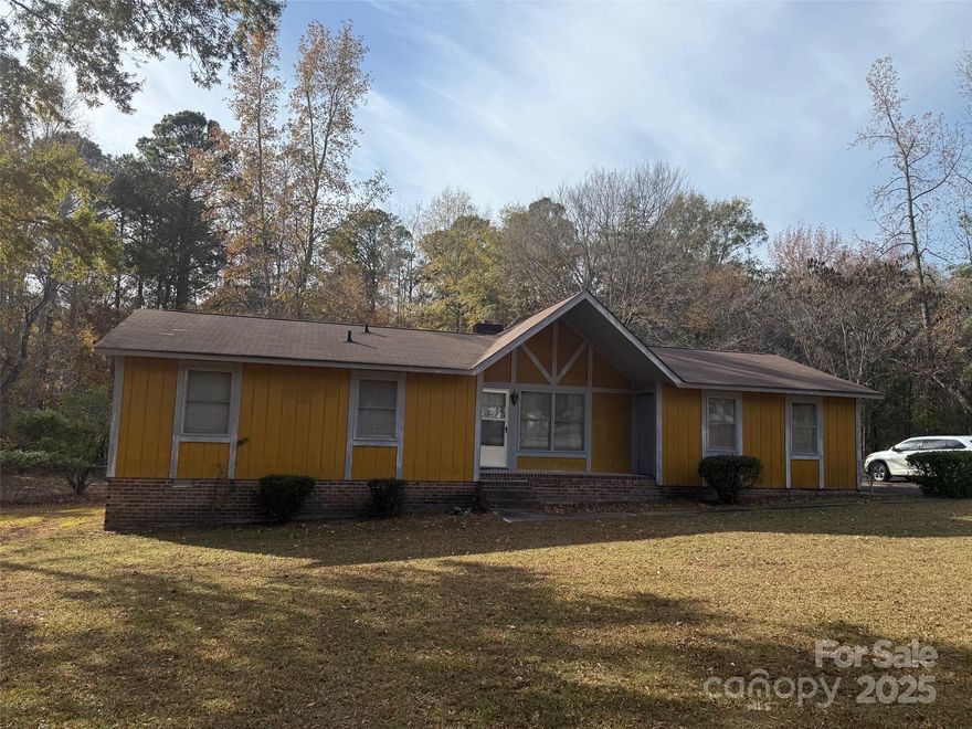 This home needs lots of love and care. It's on the market 'AS IS' but it's in an excellent neighborhood, & the yard/grounds are exceptional!  It's a 3-bedroom, 2-bath home with a nice, spacious living room/den that opens directly into the country kitchen.  A deck on the back looks over a beautiful backyard w/ shade trees. It's truly a magnificent property.  Call for an appointment to view.  INSIDE PICS COMING!