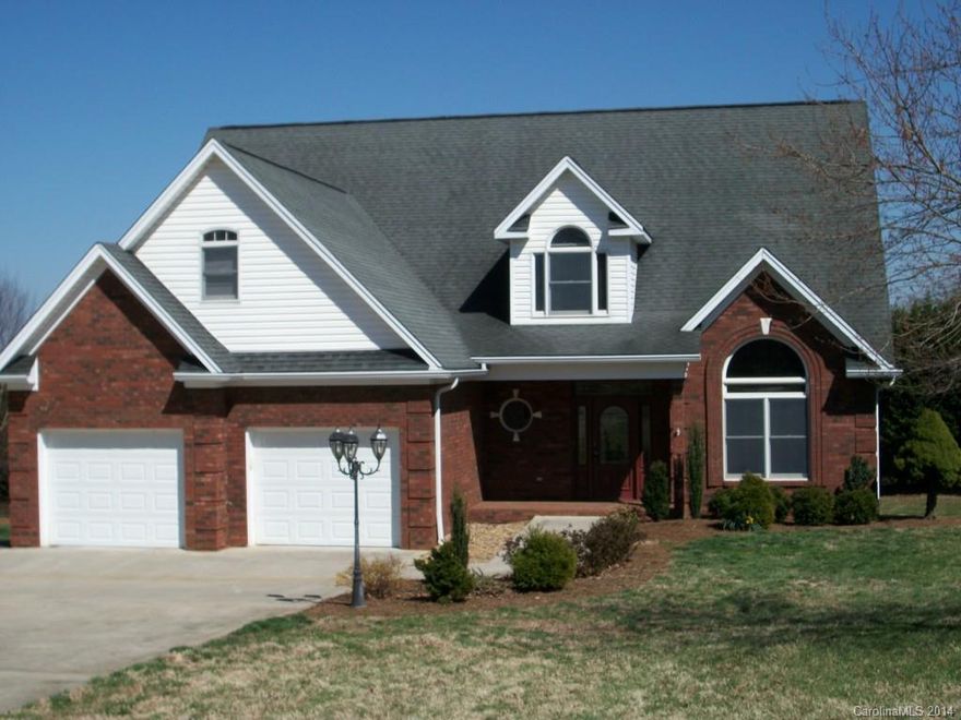 Over 4,400 SqFt, Cherry cabinets, cherry floors, tile in baths and kitchen, new granite kitchen, each floor has a great room/den, basement has wet bar, kitchenette area and gas fp, basement has paved driveway and sep garage, new carpet upstairs, new paint, 16X32 deck, large lot for outdoor activities! Great Mother-In-Law suite downstairs.