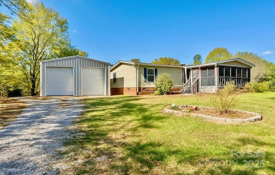 Peaceful country living on 1 acre! 3BR/2BA mobile home on a private driveway in Chester, SC. Features new floors in kitchen, dining & laundry, with carpet replacement needed—great chance to customize. Primary suite includes bonus room perfect for office or nursery. Enjoy 2 screened porches & a 30x40 wired detached garage/workshop. Well water, septic & Duke Power. Excellent investor opportunity or fixer-upper with endless potential!