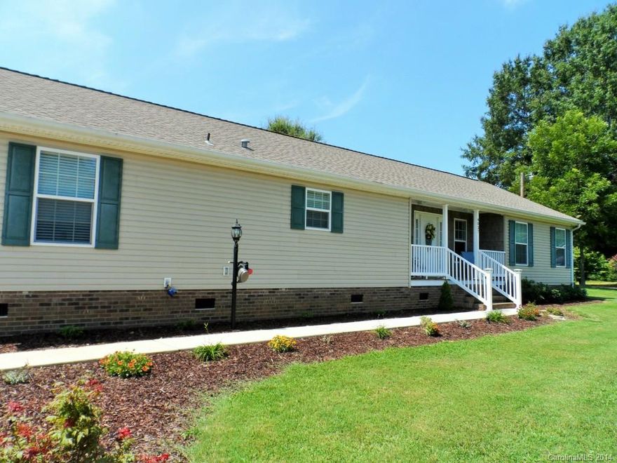 Beautiful 3 BR home located in the rolling countryside just 7 miles N of Hwy 150.  Home has open floor plan,  large LR w/ gas log FP, a split bedroom plan for privacy & the kitchen will amaze you! There's plenty of storage, a built in desk & center island.  The paint colors are neutral & if you like the outdoors, this home offers a covered front porch & a large rear deck.Level 1.2 ac. The seller is including a large storage shed w/ ramp and they are offering a home warranty!  Call today.