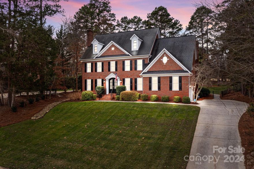 Nestled on a .63 acre lot in Davidson's River Run Golf Course Community, this custom all-brick 4BD/3.5BA home blends luxury with a picturesque setting. Overlooking the third green, it features a light-filled open floor plan, hardwoods throughout the main level, soaring ceilings in the Great Room and Sunroom and two cozy fireplaces. The updated kitchen boasts a high-end "LaCanche" 5-burner gas range with a warming cupboard, custom cabinetry, built-in panel appliances, Quartz countertops, a large island, and a walk-in pantry. Outdoors, a private oasis awaits with an in-ground saltwater pool, waterfall, spa, and flagstone patio. The backyard is fully fenced! Other highlights include a magnificent steel front doors, a formal office, living and dining rooms, a 530 sqft 3rd-floor bonus room with ample storage, walk-in storage and irrigation system. Samsung Washer & Dryer and a CHOICE Home Warranty are included. This property is the epitome of elegance, comfort, and prime golf course living.