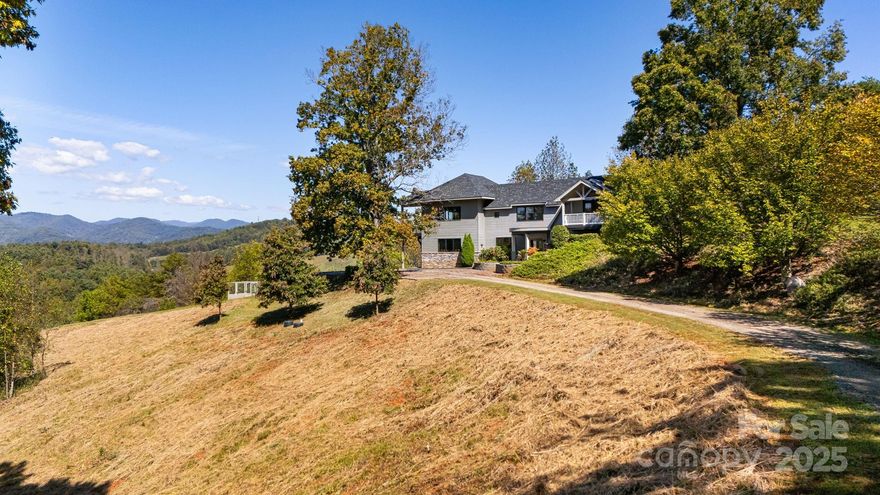 Recent price adjustment is now well below market value! Exceptional 20 plus acre Estate in Scenic Mars Hill, NC Discover this stunning estate nestled in Madison County NC, known as "The Jewel of the Blue Ridge Mountains." Started in 2000 with a small 990 sq ft cabin, then the home was expanded and newly constructed in 2017 to the present home and floor plan. Enjoy breathtaking 270-degree long-range mountain views and spectacular sunsets. The meticulously manicured grounds feature a small pasture and a vibrant array of flowers that attract pollinators. With NO HOA and NO restrictions, you have the freedom to embrace country living and raise chickens for a fresh egg breakfast, right on your choice of two balcony decks! A small, fenced coop behind the house has previously served as a garden for fresh herbs and berries. Land is surveyed for a small development of 10 homes. There are numerous potential home sites identified in the survey, perfect for building a separate guest quarters or a short-term rental if desired. The current home expansion was completed in 2017 with a finished heated and cooled area of 3391 sq ft. When combined with the decks, garage, garage utility flex space, and all non-HLA areas, the home has a total of 5197 sq ft. A 1/4-mile driveway ensures privacy, and if desired, a paved road for your luxury or classic vehicles can be easily installed, but is not needed, a paving estimate is available. Any car can access the home easily. Conveniently located just 8 minutes from Mars Hill Ingles grocery store and college, Hot Springs 35 minutes, 17 minutes to Weaverville Publix, 26 minutes to downtown Asheville, and 40 minutes to the Asheville airport. Escape to the serene beauty of the Western NC Mountains and claim your own generational private estate. Experience peace, tranquility, and the stunning four-season colors of this expansive mountain view from your private, custom Trex wood terrace, with truly breathtaking year-round views! Make this estate your “Jewel of the Blue Ridge Mountains”.  Please review the extensive feature list, which includes High-Quality construction throughout the home. A Matterport home tour link is also available. The mountains are calling and I must go! Schedule your showing soon!