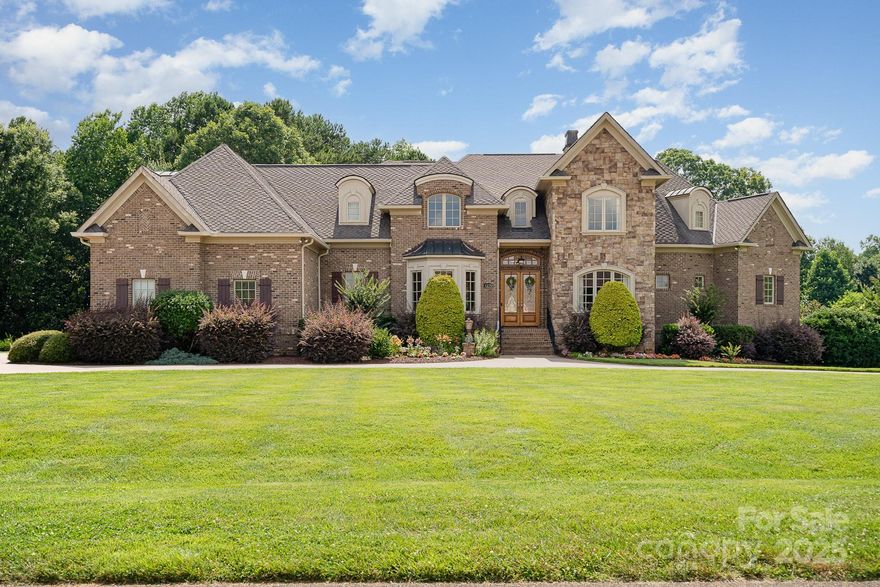 Stunning estate w/ 6 acres nestled in the prestigious gated community of Teeter Farms Estates in Mooresville. This magnificent home offers over 7,000 square feet with main level primary & 2nd living quarters in the expansive basement. 2 story great room overlooks the private and lush backyard. All en-suite bedrooms with walk-in closets. Upstairs are 3 bedrooms, bonus room and a laundry room.  On the main level you will find an office, formal dining and living rooms, and an amazing kitchen with breakfast area and keeping room with fireplace and vaulted ceiling. Kitchen also features an impressive island, walk-in pantry and all Viking appliances. The basement is perfect for entertaining on a more casual level with a fireplace in the family room, a full kitchen with pantry, potential wine room, breakfast area and keeping room with fireplace. There is also a future movie room or use as a hobby room, garage & screened porch. This home is not to be missed! 6 acres consists of 2 lots