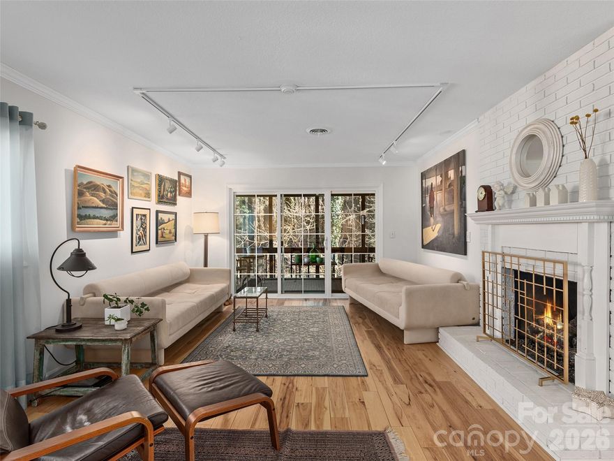 Motivated Seller. All reasonable offers considered. Some furniture available for sale in separate agreement. Perfectly redesigned, this very special condo will appeal to anyone who likes an open floorplan and meticulous attention to detail. A split bedroom plan provides privacy plus updated bathrooms in each suite. The floors are all hard surface, tastefully installed with light wood or matching contemporary tile. The gourmet kitchen features pullout shelves and pantry, soft pull drawers and a console along one wall for extra storage and entertaining. Whirlpool Gold series appliances were chosen. Relaxing large screened-in back porch. Close to the forest and away from the street you can’t help but relax. A separate deeded garage offers plenty of additional storage and a safe place for your vehicle out of the weather. This home is conveniently located less than 2 miles from historic downtown Hendersonville, Pardee Hospital and major roadways. Don’t miss out on an a beautiful, affordable home in the fast growing community of Hendersonville.