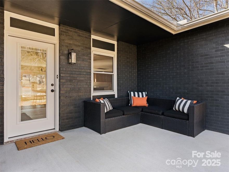 This tastefully renovated home offers single level living with an oversized, open-concept great room perfect for entertaining, a primary suite with private bonus space (Think office, sitting room, nursery etc.) two additional bedrooms, plus a large bonus room. The kitchen features an oversized custom island, stunning quartz countertops and recessed vent hood to keep an open feel. Take in the mountain views right from the newly poured concrete back patio! All this sitting on a large, flat yard perfect for family gatherings or furry friends. boarded by a beautiful creek and the Ecusta Trail.