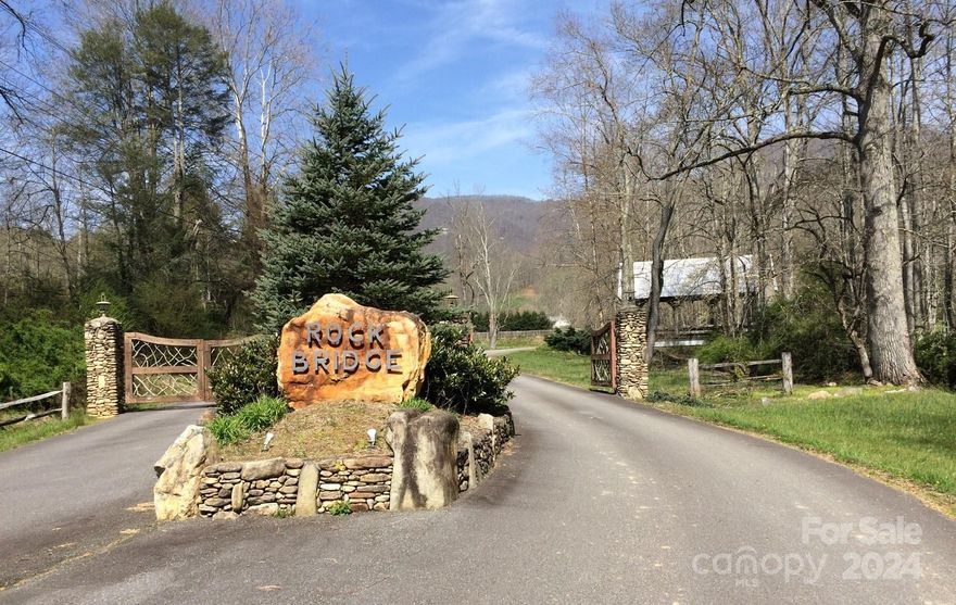 One Acre Wooded Lot in the Gated Community of Rock Bridge. 10 to 12 minutes to Waynesville and Maggie Valley. City Water, buried utilities, Wide Paved Roads, Well Maintained and Beautiful Subdivision.