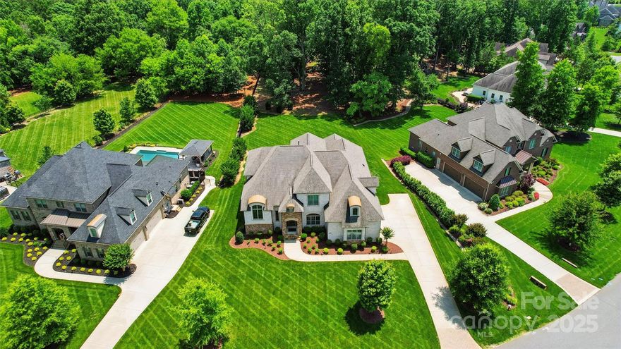 Absolutely IMMACULATE 5BR/3.5BTH full brick in upscale Atherton community! Located on almost 1 ac, the Amherst plan by Shea Homes offers an open concept plan w/lots of natural light, owner's suite down & signature "mid-level" living rm/den/office between 1st & 2nd floors accessed off curved staircase. Lots of plantation shutters. 5" handscraped wood flrs. Gourmet kitchen w/custom cabs,soft pulls,undermount lighting,designer glass subway tile, huge island w/bar seating, farmhouse sink, gas cooktop,dbl ovens, updraft vent hood & wine fridge. Breakfast area w/more cabs. Huge dining rm w/lots of moldings & built in buffet. Great room w/oversized gas log fireplace, custom mantle & built-ins. Huge owner's suite w/dbl tray ceiling & sitting rm. Gorgeous spa-like bath w/dual vanities, huge frameless walk-in shwr w/rainfall head, bench seat & soaking tub. Dual walk-in closets. Upstairs- 4 more generous br's w/walk-in closets, bathrooms w/dual vanities & massive bonus rm. All Weddington Schools!