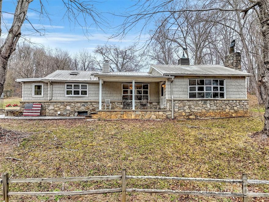 Surrounded by a peaceful, natural setting, this unique mountain cottage offers classic charm and inviting warmth throughout. The home blends seamlessly with its surroundings, providing a comfortable and welcoming atmosphere. Inside, the home offers a functional layout filled with natural light and character-rich details. Large windows bring the outdoors in, while the cozy living spaces create an inviting environment ideal for full-time living, a mountain getaway, or a second home. Additional space is available for storage or future possibilities, adding flexibility to the property. This home offers a wonderful opportunity to enjoy peaceful mountain living while remaining conveniently close to nearby towns, dining, and outdoor recreation. A truly special property for those seeking privacy, charm, and a connection to nature.