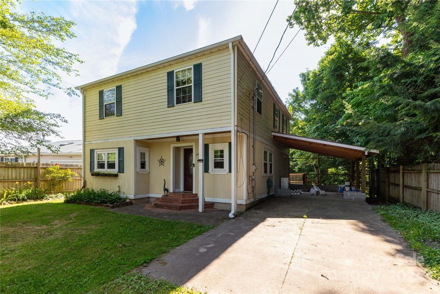 Quaint cottage with mountain views just .7 miles from downtown Waynesville shopping, restaurants and breweries! With some TLC this home would be perfect for primary residence or as investment property. Main level has large living room with fireplace that could have gas logs insert (it has been sealed, not wood burning), kitchen with newer appliances, two large areas for dining/office space, mud room, and half bath/laundry. Three large bedrooms with sizeable closets and full bathroom with both shower and soaking tub upstairs. Mountain views from each bedroom and the large deck overlooking fenced, shady back yard.