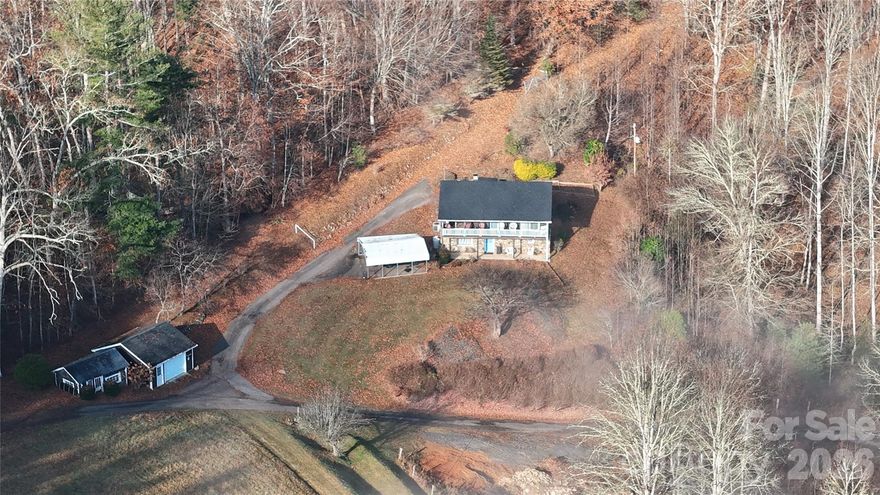 Welcome to nearly 17 acres of unrestricted mountain property offering privacy, usable land, and endless potential in the heart of Burnsville. This unique property combines a comfortable home with the kind of acreage that is becoming increasingly difficult to find, especially with this level of accessibility and versatility. Tucked into a peaceful setting, the property provides a rare opportunity to enjoy both seclusion and convenience while being surrounded by the natural beauty of Western North Carolina.

The home features 3 bedrooms and 1.5 baths with a functional layout and inviting living spaces that make it well-suited for full-time living, a second home, or even an income-producing rental. The interior offers a warm and comfortable atmosphere, with spaces that can easily be updated or personalized over time to match your vision. While the home itself provides a solid foundation, the true value of this property extends far beyond the structure.

The owners have taken excellent care of the home and completed significant updates, making it move-in ready and worry-free for years to come. Major improvements include a new roof installed in 2021, an updated heat pump in 2021, a new well pump along with an added filtration system, plus a spout for easy access to natural spring water, and a new hot water heater installed in 2023. These thoughtful upgrades ensure comfort and efficiency while preserving the charm and character of this mountain property.

The land is where this property truly shines. With multiple areas of usable terrain, established logging roads, and a natural flow throughout, the property offers excellent accessibility across the acreage. Whether you’re walking the land, exploring potential homesites, or simply enjoying the peaceful surroundings, you’ll find that the layout allows for a variety of uses without feeling restricted by steep or unusable sections. The existing road system makes it easy to navigate and opens up possibilities for expansion or further development.

This property is ideal for those looking to create a homestead, mini farm, or private mountain retreat. There is ample space for gardens, animals, workshops, or additional structures, giving you the flexibility to design a lifestyle that fits your needs. The natural setting provides a sense of calm and privacy that is hard to replicate, making it a perfect escape from the pace of everyday life.

One of the most valuable aspects of this property is the freedom that comes with no restrictions. This allows for a wide range of uses, including additional homesites, guest homes, recreational use, or long-term investment potential. Whether you’re looking to build out a multi-generational property, create income opportunities, or simply hold the land as it continues to appreciate, the options here are truly open-ended.

Whether you're looking to spread out, bring animals, establish a self-sufficient lifestyle, or create your own vision in the mountains, this property offers the flexibility to do so. The combination of acreage, usability, and location makes it a standout opportunity for buyers seeking more than just a home.

Conveniently located while still offering a sense of seclusion, this property allows you to enjoy the best of both worlds—peaceful mountain living with access to nearby amenities, shopping, dining, and outdoor recreation. Opportunities like this, with nearly 17 acres of unrestricted land and room to grow, are becoming increasingly rare in this area.