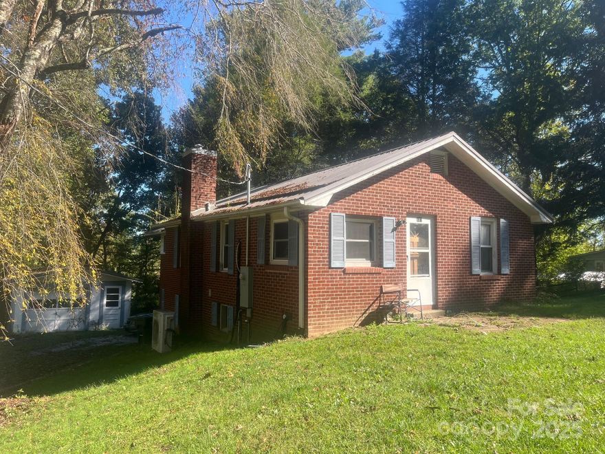 Updated brick ranch home in convenient Zirconia location. Situated on .85 +/- acres, this home features 3 main level bedrooms with bath and large living area. The basement is finished with bonus room, bathroom, kitchen and dining area. Due to the ceiling height being less than 7' in basement, this is not included as heated living space. Recent updates include new vinyl flooring and ductless mini-splits installed in the prior 10 years. Great home seeking new owners, schedule your showing today!