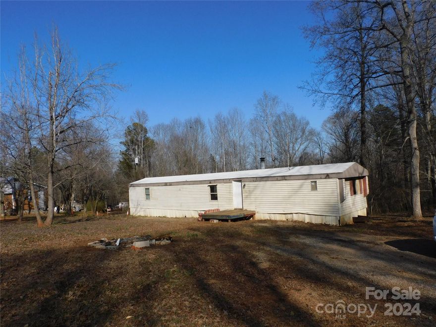 5 country acres with well and septic installed.    3720 Turner Road Clover, SC  Older 14x70  (14x66) single wide mobile home with no title to convey and NO VALUE IS GIVEN  FOE SINGLEWIDE!  Value is on land alone.  Being sold "as is" and "where is".  A handman may repair and improve the mobile home after closing or haul it off at buyers expense.  handy man special or place your new home on land... many options!  Same as MLS4113624 in Land/Lots
