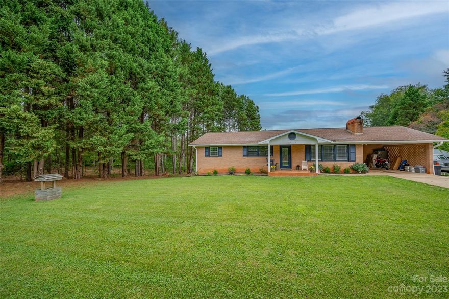 This One level brick home is situated on 5.77 acres and offers the perfect mini farm opportunity. The home has many recent improvements including a primary bedroom suite with new bath including a large tiled shower and walk in closet. New waterproof plank flooring, updated kitchen with all new stainless appliances and adjoining office/flex space. Spacious living room with wood burning fireplace. The basement has been partially finished with 3rd bedroom, full bath and family room with 2nd fireplace. Just needs your finishing touches. Large private rear deck overlooks the property which includes a one stall barn, new 24'x24' workshop with mini-split heat/ac. The property is fenced with a combination of field fencing/chain link w/dig barrier. Plenty of garden space. RV site at the rear of home with septic hookup and H/C water. Located in the beautiful Green Creek area only a few minutes drive to Tryon, Columbus & Landrum. NOTE: Closed for more than listed due to multiple offers.