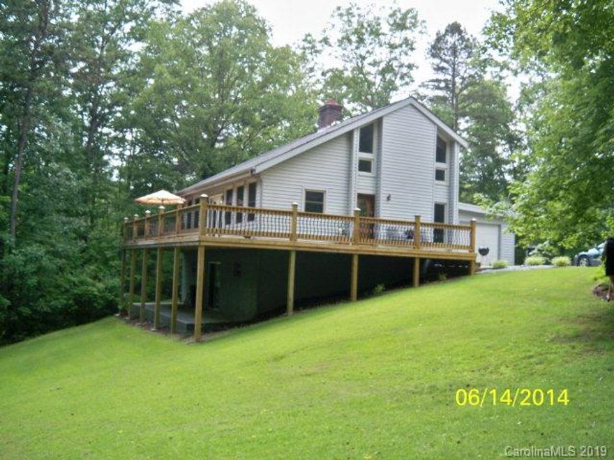 If you are looking for privacy,acreage and a beautiful home,this is the property for you! This home has an open floor-plan with beautiful hardwood floors,a brick fireplace with insert,a spacious kitchen,3 bedrooms,2 bathrooms,a garage and a basement.The Basement has also been plumbed for an additional bathroom if desired. Enjoy these warm summer days on the large deck surrounded by the wooded privacy of 10 acres. This home has had many updates,including the deck,a roof in 2012,stainless appliances and Dove lifetime warranty windows throughout the home.Storage building included. Must see to appreciate!