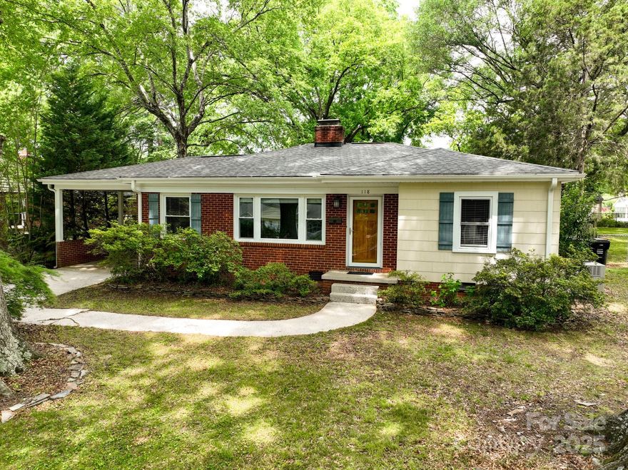 Welcome to this charming 3/2 ranch nestled in an established & sought-after neighborhood—just minutes from the vibrant downtown, shopping, dining, and grocery conveniences.

This home blends timeless finishes with thoughtful updates, featuring wood & tile flooring throughout, elegant chair and picture molding, & a cozy fireplace. The inviting living room showcases a picture frame window, flooding the space with natural light.

The kitchen comes equipped with sleek stainless steel appliances, while both bathrooms are tastefully updated for modern living. A craftsman-style front door adds architectural flair & curb appeal while inside French doors & crown molding enhance the home’s character.

Step outside to your private oasis—a fenced backyard complete with a paver patio  & fire pit for effortless entertaining. The exterior is low maintenance & the roof replacement (2021) offers peace of mind for years to come. A spacious storage building & attached carport add extra convenience.