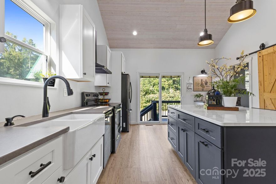 Modern Design Meets Unique Character!
Built in 2021, this stunning 3-bedroom, 2-bath home offers 1,727 sq. ft. of thoughtfully designed living space on nearly an acre of land. Step inside and be captivated by soaring, high-peaked ceilings finished with warm wood planks, creating an airy yet inviting atmosphere. Designer touches and unique finishes set this home apart, while a striking spiral staircase leads to a versatile loft complete with a mini-split system; perfect for a home office or cozy retreat.
Enjoy the beautifully landscaped front yard and an open, cleared backyard ideal for outdoor living. Conveniently located within walking distance to North Iredell High School, Proximity to Stores like Walmart, Food Lion, Lowes and Home Depot Plus Several other big box stores. 
this property combines modern style with everyday practicality. Don’t miss your chance to own this one-of-a-kind home!