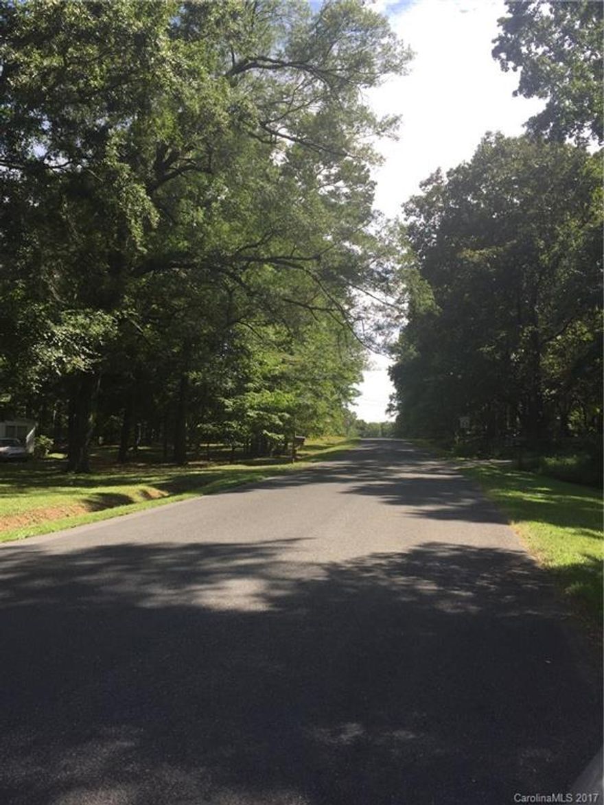 Live in Midland on over an acre! Fifteen minutes from Charlotte, Concord or Monroe- Private, country setting with award winning schools. Septic and well already in place. Lot is currently income-producing- There is a tenant who owns the mobile home on property, and has leased the lot for the last 20 years, currently at $200/month. They can remain or go, at new owner's request. Buy now and build later in one of the best areas of the Piedmont region!