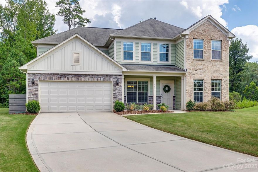 Welcome home to Audubon Lakes! This stunning home sits on a level, cul-de-sac lot. Private tree lined backyard with a large covered patio & firepit. The heart of this home lies in the newly updated kitchen, stainless steel appliances, quartz countertops, pantry with custom shelving & butlers pantry. The kitchen seamlessly opens up to the great room and sunroom. Upstairs, the primary suite features two walk-in closets, a luxurious bath with granite countertops, dual sinks and a spacious walk-in shower. The other 3 bedrooms on this level are generously sized & the open loft space upstairs is a great flex space. Three car tandem garage boasts generous storage. Community amenities, include a pool, playground, cabana & walking trails. Positioned conveniently between Ballantyne and downtown Fort Mill, this residence is surrounded by a charming assortment of restaurants, coffee houses, shops, nearby park, and the Anne Springs Close Greenway. This one will not last long - make an offer today!