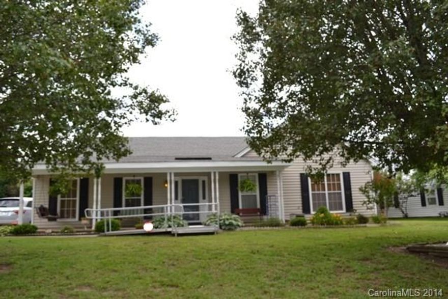 This home has brand new exterior vinyl siding!  Rocking chair front porch, side porch.  3 bedrooms, 2 baths, beautiful laminate flooring in kitchen and eating area.  Newer appliances in kitchen.  Newer heat pump and gas water heater!  Wired workshop!  Ramp will not remain with the house.  Great location, close to shopping, restaurants and interstate!