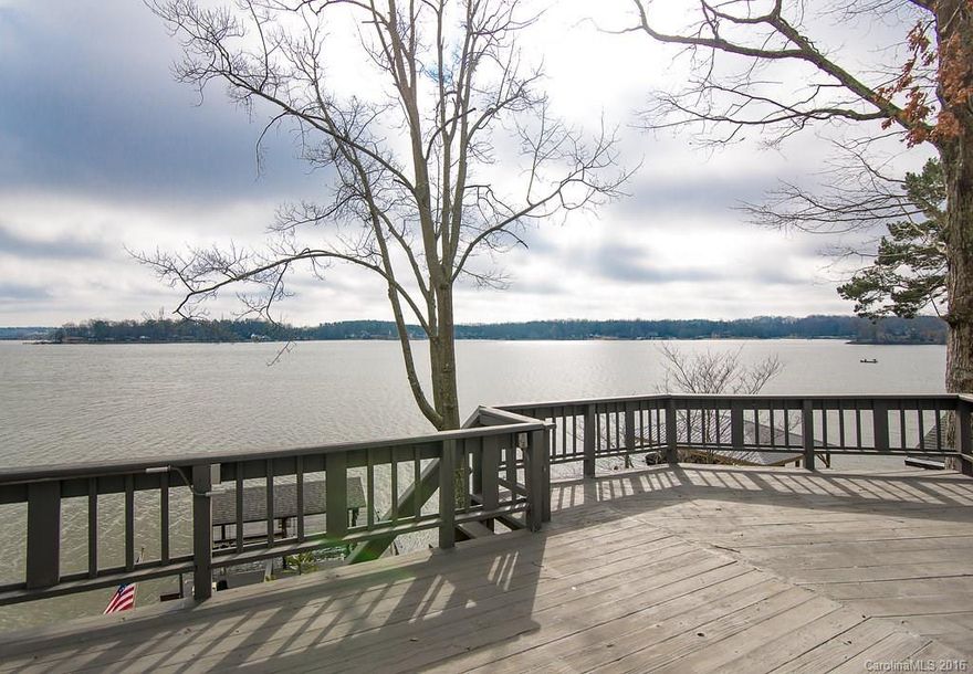 Tega Cay, main channel, waterfront home!  Live on vacation, with expansive waterviews everywhere.  Deep water docking for your boat and wave runner.  Two levels of decks and patios for outdoor entertaining- including a hot tub, outdoor shower and a retractable awning.   Inside are all the upgrades you would expect, including some heated tile floors!  This home is street level with 2 driveways/a garage & carport.  Located on a quiet cul-de-sac, & a fully landscaped lot with no grass to mow!