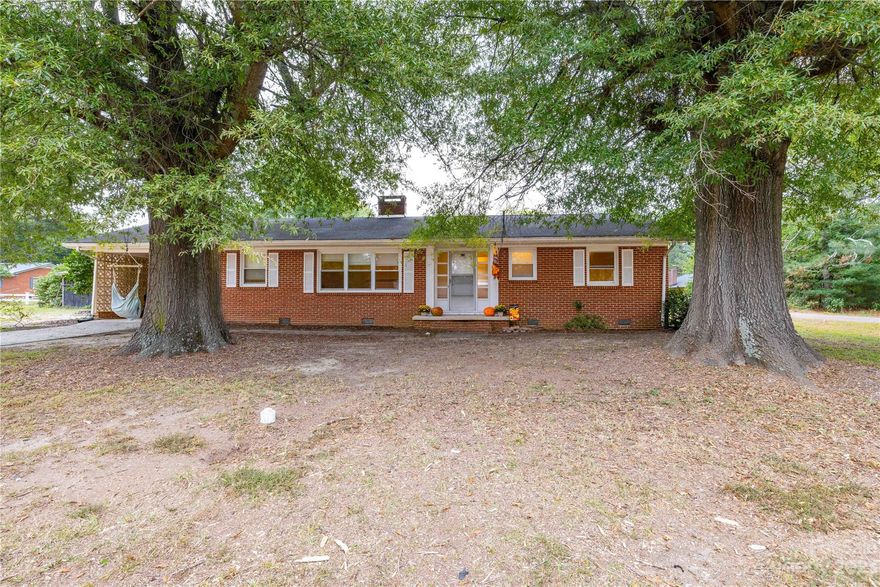 Sellers are requesting highest and best offers by 10am, 12/19/23.  Welcome to your 2-bedroom, 2-bath brick home, nestled on a peaceful street with a generous half-acre of land, which includes two separate parcels. As you step inside, the hardwood and luxury vinyl plank (LVP) flooring will greet you, creating an inviting and warm ambiance. The open and spacious layout offers the perfect backdrop for comfortable living. The charm of this property extends beyond the home itself. Imagine the possibilities with a covered open shelter pole barn, a versatile space that could serve as a storage haven for your RV, camper, or even your personal workshop. Whether you're seeking a peaceful retreat or a space for your hobbies and outdoor adventures, this property has it all. It's more than just a home; it's a canvas for your dreams and a retreat from the hustle and bustle of life, make sure it doesn't slip away!