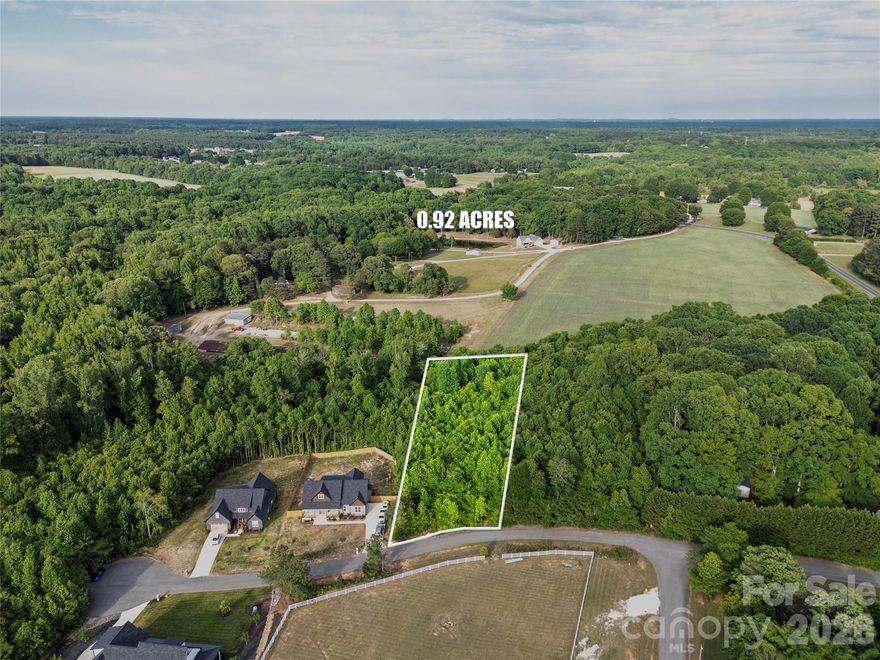 For MLS public remarks, you’ll want it cleaner, more compliant, less promotional, and without personal branding/contact info. Here’s a polished MLS-friendly version with a stronger luxury/custom-build approach while still keeping your original details and flow:

Experience the perfect balance of tranquility, luxury potential, and convenience with this beautiful .92 acre lot nestled in a peaceful rural area of Kannapolis. Surrounded by newly built custom homes and scenic surroundings, this property offers the opportunity to create a truly personalized living experience while being just 10 minutes from vibrant Downtown Kannapolis.

Whether you are ready to build now or invest for the future, this property is ready to go with a completed perk test approved for a 4 bedroom home. Situated in a quiet subdivision with no HOA, you will have the freedom to design and build the home you envision without added restrictions.

New construction homes are actively being built throughout the neighborhood, with recent sales reaching the high $700s, showcasing strong demand and excellent long term value. Buyers also have the opportunity to work with builders already building within the community, helping simplify the custom home process while allowing flexibility to match your vision and timeline.

Do not miss this rare opportunity to build your dream home in a growing community where privacy, comfort, and convenience come together.