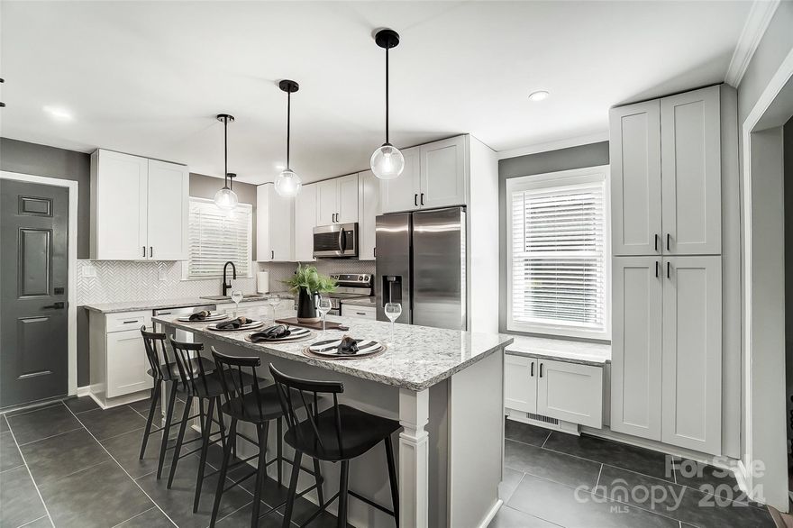 Back on the market at no fault to the seller! Welcome to this stunning completely renovated ranch-style home nestled in a quiet neighborhood less than 5 min away from historic downtown York! This charming home has been thoughtfully remodeled with gorgeous design choices and luxurious finishes. As you step inside, you are greeted by the timeless elegance of beautiful crown molding in the main areas, designer paint colors, and gleaming LVP flooring throughout. The open-concept layout effortlessly connects the living, dining, and kitchen areas, providing a seamless flow for everyday living and entertaining. The fabulous kitchen features custom cabinetry w/soft close hardware, granite countertops, a huge island, coffee bar, SS appliances, modern porcelain floor and herringbone tiled backsplash. Spectacular bathrooms with granite counters, custom ceramic tiled, modern fixtures and impressive finishes. Step outside to the private backyard oasis w/new wood patio for outdoor entertaining.