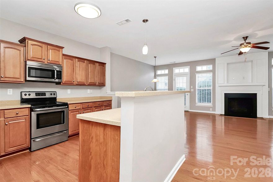 Beautiful 3-bedroom, 2.5-bath townhome with a 2-car garage in a prime Huntersville location close to everything the area has to offer. Recent updates include whole home painted including ceiling and new carpet installed! The main level features a spacious dining room with tray ceilings, hardwood floors throughout, a large open kitchen, and a cozy fireplace in the living room—perfect for cool evenings. Upstairs you’ll find three generously sized bedrooms with LVP flooring and ample storage and two full baths. Step outside to enjoy the private patio and fenced backyard. Conveniently located near I-77, I-485, Birkdale shopping, restaurants, and grocery stores.