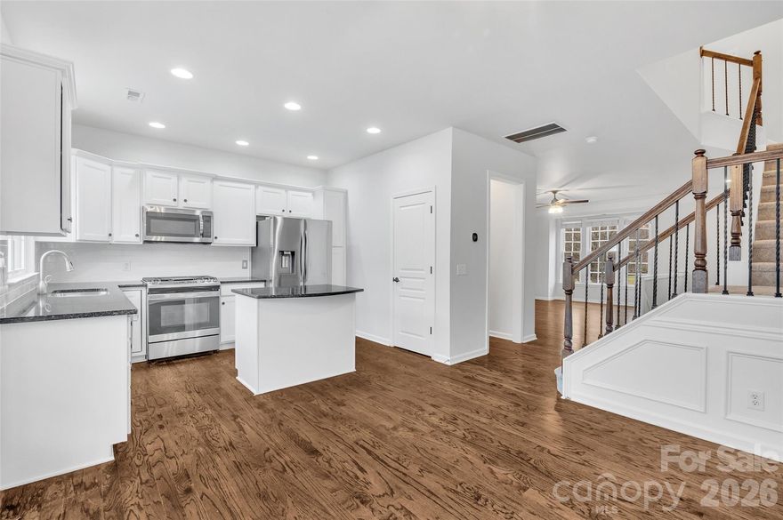 Baxter Village END UNIT Three story townhouse with 2 car Garage! Overlooks the common green space! Hardwood floors on main refinished 2024, Brand new carpet (2026), fresh paint.  The kitchen has new tile backsplash (2026), granite counters, island, white painted cabinets and stainless appliances including dishwasher (2025), gas range with griddle and French door refrigerator (2025).  Lower level: bonus/bedroom/office and full bath ensuite, plus 2- car garage. Main floor:  Living room with gas fireplace, decorative molding, wrought iron railings, Half Bath, Dining area, Kitchen with pantry, walk out to the private deck. Upstairs:  TWO Primary bedrooms with 2 full baths (one remodeled 2024) & laundry including washer/dryer.  Enjoy the amenities of Baxter Village: walking trails, parks, community pool, Baxter Town Center with restaurants, coffee shop, bakery, retail shops, library, fitness center & more. Fort Mill Schools. Please verify with the district for most up to date school assignments. Close to Kingsley shopping & restaurant area, Anne Springs Greenway, the historic downtown Fort Mill. Fort Mill, SC is located just over the NC/SC state line. Easy access to I-77 with a 30 min commute to Charlotte or CLT airport.