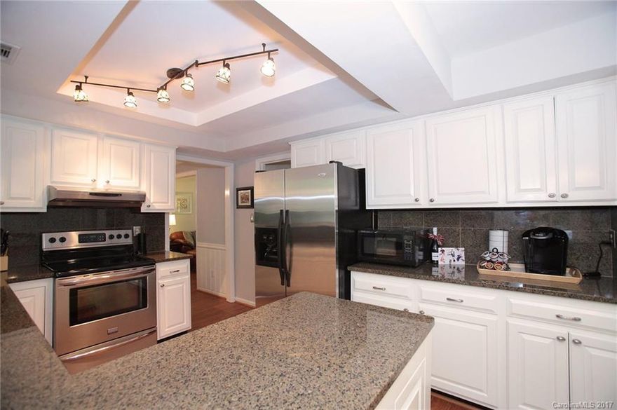 Nestled in a quiet cul-de-sac, surrounded by lush, mature trees, this outstanding colonial provides sanctuary from the busy world. Boasting .75 acres with Four Mile Creek meandering through the back of the property. Newly painted walls & cabinets. New carpet. Gas burning fireplace. Massive back deck, new landscaping & hot tub. Gutter guard system, garage organizational wall and work bench with cabinets, large storage shed with cement floor, fenced back yard & wired invisible dog fence.