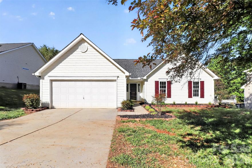Fantastic 'Boulder Creek' home fresh and ready for it's new owner! This lovely ranch home offers one-level living with an inviting open floor plan concept. With an abundance of natural light and soaring ceilings, this popular floor plan flows well and highlights a gas fireplace and large kitchen. The spacious kitchen offers an island with bar seating, granite countertops, pantry, and stainless appliances (incl. refrigerator). The dining area overlooks the nice backyard and offers access to the outside patio area. The primary bedroom offers a ceiling fan, walk-in closet, and a primary bathroom with dual vanity sinks and a shower/garden tub combo. There are two secondary bedrooms. Outside, you can enjoy the nice curb appeal, patio, and trees/landscape, and centrally located lot. This lovely home also has a two-car garage with opener. If you're looking for a low maintenance single story home that's move-in ready with lots of updates and appeal, look no further! This home delivers comfort, convenience, and an appealing open floor plan.
