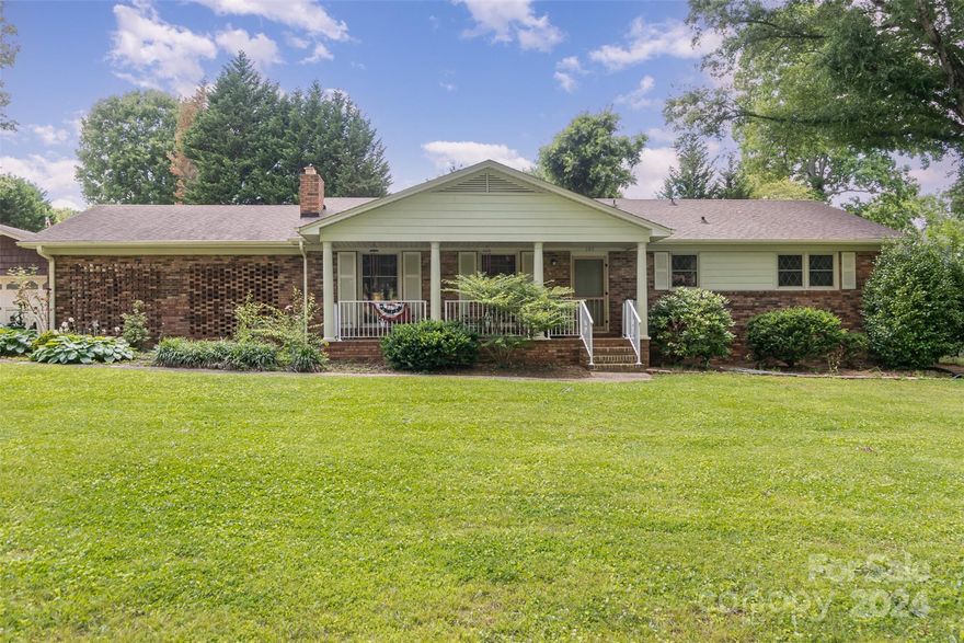 Enjoy the freedom of NO HOA & .87 of an acre. Invitingly nestled on a charming corner lot, this low maintenance full brick ranch home exudes warmth & character. Boasting 3 bedrooms & 3 full baths, the house has undergone modern updates including an updated kitchen with a sleek island, granite countertops, & stainless steel appliances. Fresh paint & new flooring throughout bring a sense of renewal to every room. Quiet sunroom at the back - a serene retreat overlooking the private fenced backyard. A unique feature is the attached carport along with a two-car garage offering ample parking Space. The heart of this home lies in its open main living area which effortlessly blends style with functionality; perfect for hosting gatherings or simply unwinding after a long day. The dining area presents versatility with two closets, presenting itself as an ideal spot for either an office setup or potentially transforming it into a cozy fourth bedroom to suit your needs.