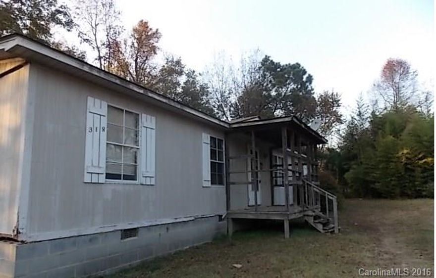 City of Troy location!  Front and Rear Decking and Porch.  Living Room and Dining Room with Laundry area off Kitchen.  Make this one first on Your List!