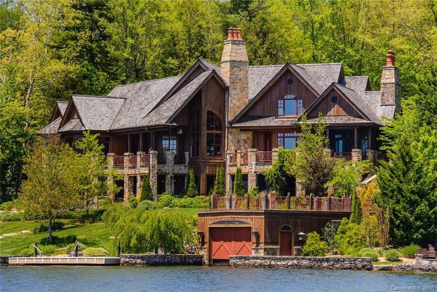 One of Western North Carolina's finest lakefront estates located on the shores of Lake Toxaway! This gated home, with 335 feet of lake frontage on North Carolina's largest private lake, has 1.33 acres and a total of 9,929 heated square feet. Built by John Lupoli, this house has an elevator, whole house generator, multiple stone fireplaces, large gourmet kitchen, magnificently landscaped grounds, double-stall boathouse, wine cellar, massage room, billiard & theater rooms w/ plenty of amenities.