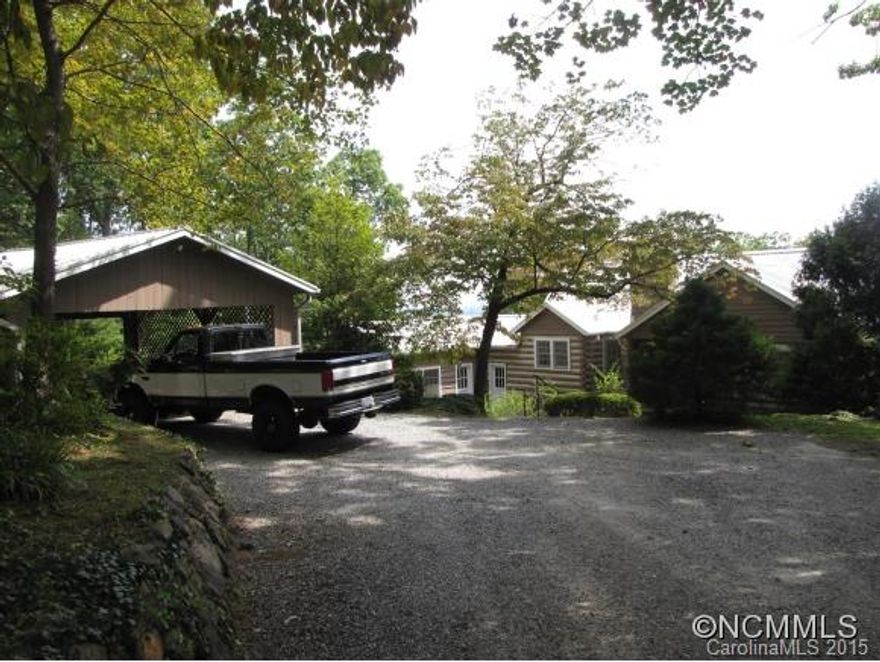 Charming old growth wood log cabin site built in 1950 with lots of built in cabinets. On three acres, the garden area is fenced in and large enough for pets. The mountain view is good in the summer (even better in the winter) and can be seen from the family room and back porch. Hardwood floors throughout except for the bathrooms and kitchen. The basement has lots of storage shelves and the attic has plenty of room for storage as well.
