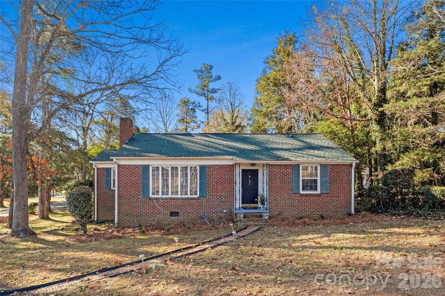 Charming Brick Ranch on a Corner Lot in Country Club Estates! This adorable brick ranch offers the perfect blend of comfort and character. Featuring two bedrooms and two bathrooms, the home boasts hardwood flooring throughout, adding warmth and timeless appeal. You’ll love the two spacious living areas — ideal for a family room, play space, or cozy hangout spots. The kitchen sits at the heart of the home and features painted white cabinets paired with granite countertops. Outside, the large corner lot is shaded by beautiful mature trees, creating a peaceful setting. A truly charming place to call home!