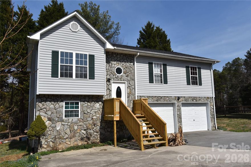 Charming 3 Bedroom Split Foyer in Downtown Hudson, NC. 3 bedroom, 2 bath split foyer home located in downtown Hudson within walking distance to shopping and local amenities. This home features an open floor plan with a spacious living room that flows into the dining area and kitchen, creating a comfortable space for everyday living and entertaining. The primary bedroom includes its own full bathroom. The basement offers two additional rooms that provide great potential for extra living space, office, or hobby areas. While these rooms are not counted in the heated square footage due to unfinished ceilings and flooring, they offer plenty of possibilities for a new owner to complete and customize. Recent improvements include a new roof, new front porch, and a new back deck. The seller has also been updating the interior with fresh paint and new flooring and is currently working to finish the trim work throughout the home. This property offers great potential and flexibility for a new buyer looking for a home in a convenient downtown location. Come and see!