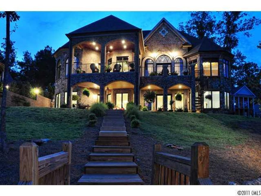 The ultimate in Lake Living awaits you in this spectacular home with breathtaking views of beautiful Lake Tillery from almost every room.  Open floor plan, lot's of windows, wood and tile floors, beautiful ceilings throughout, tinted windows, covered balcony overlooking lake from office, outside rock fireplace with gas logs, home theatre room fully furnished, granite counter tops, and much more.