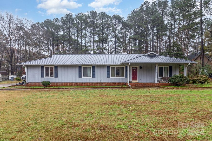 This spacious four-bedroom, three-bathroom residence features a large living area that separates the primary suite from the other bedrooms for added privacy. Set on a flat lot, enjoy an outbuilding for storage or hobbies, plus a refreshing in-ground fiberglass swimming pool—perfect for summer fun, though it may require resurfacing and some mechanical updates. Located just 2 miles from the nearest boat ramp, this property offers easy access to the stunning waters of Lake Norman, making it a paradise for water enthusiasts.