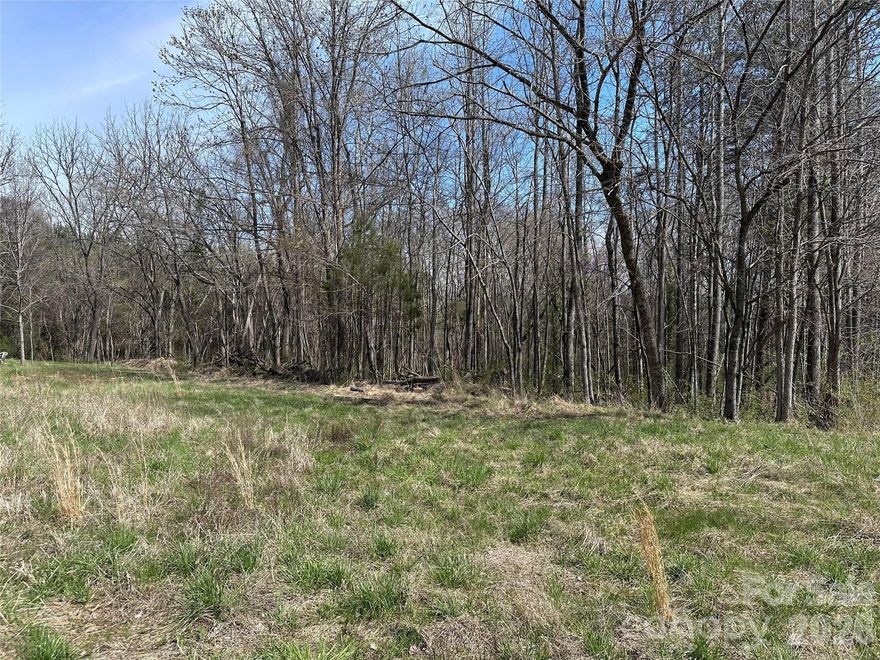 A well-positioned 32.9-acre tract in Davie County offering road frontage, nearby utilities, and R-20 zoning outside town limits. Wooded acreage with a stream through the property provides both aesthetic and environmental value. Proximate to Cooleemee Elementary School. Ideal for the patient investor looking to secure land ahead of future residential demand in the Davie County market.